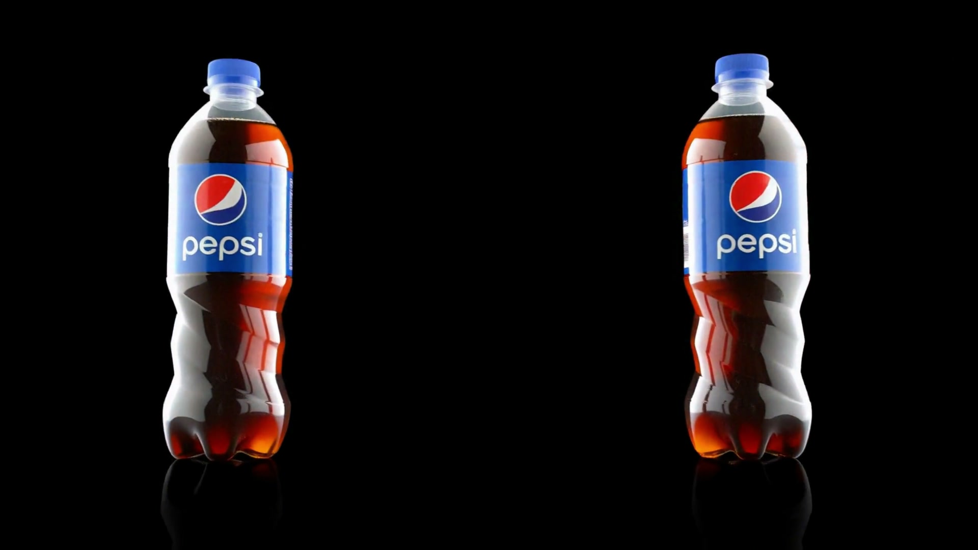 A frame from the unofficial Pepsi Max spec test: two Pepsi bottles standing side by side on a reflective black floor under blue rim light.